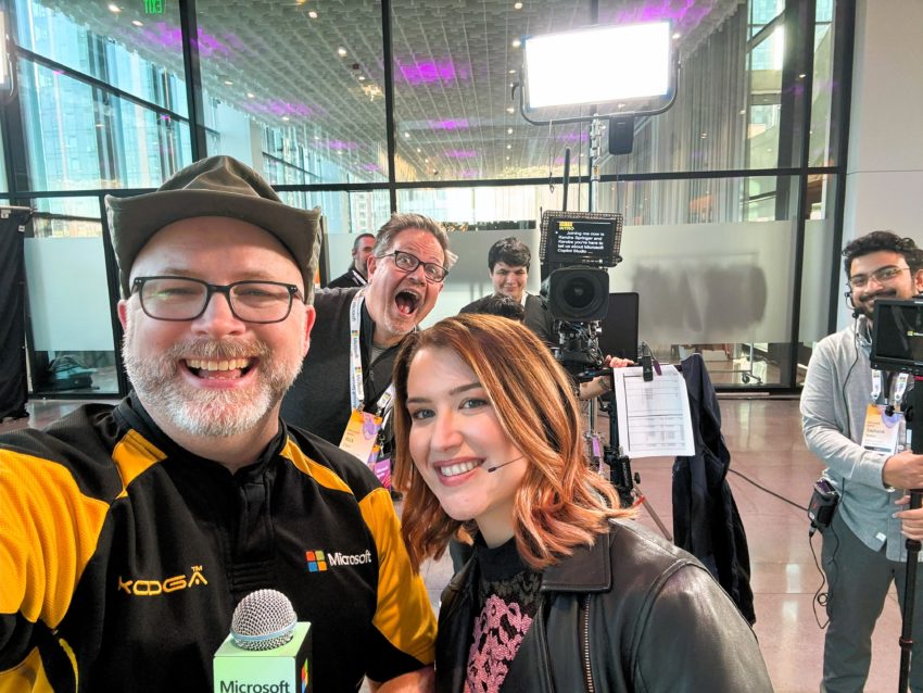 Selfie shot of myself interviewing Sarah Young on set at Microsoft Ignite with camera crew in background. Joey Snow is photo-bombing us.